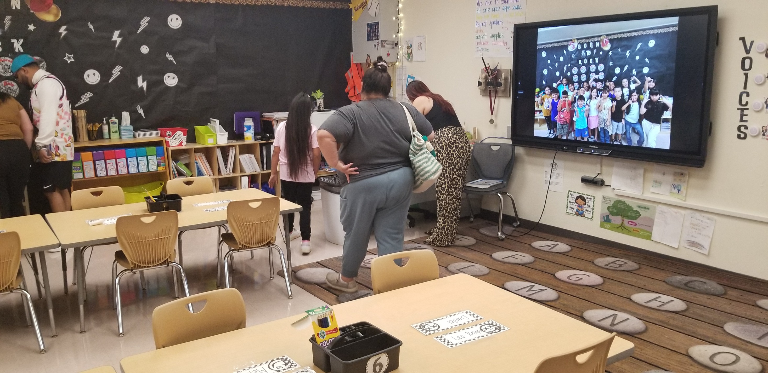 Families check out a classroom during Open House