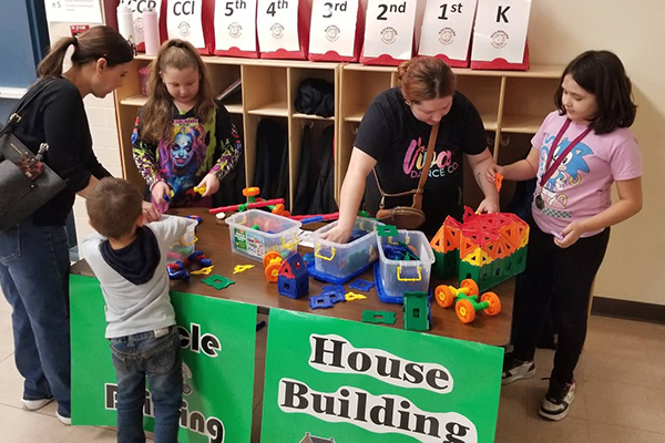 Students build things out of colorful blocks