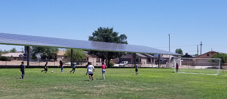 Students play soccer out on the fields